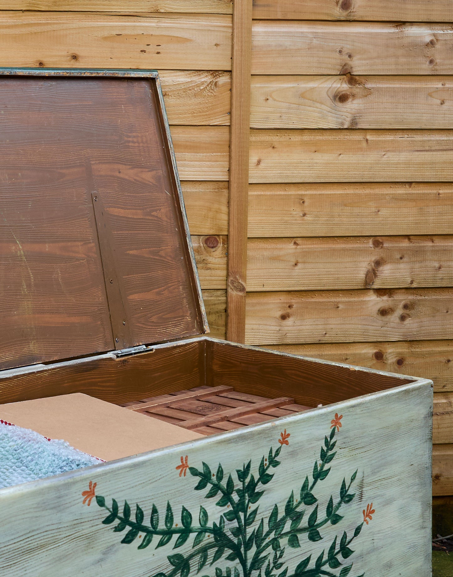 A Hand-Painted Pine Blanket Box with Botanical Motif