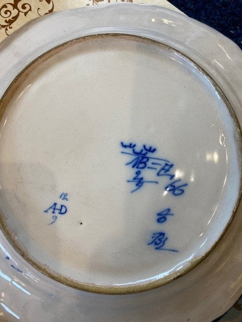 Two 18th Century Faience Rococo Plates with a Four-Pass Shaped Rim Glazed in White with Polychrome Decorated Flowers in Blue