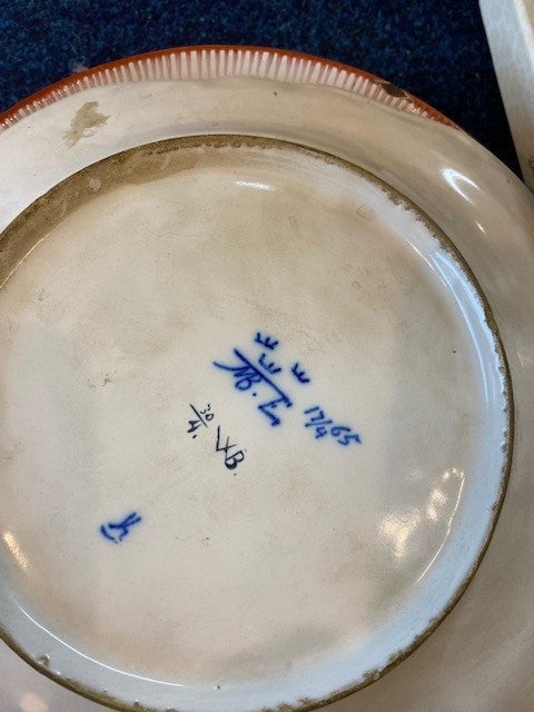 Two 18th Century Faience Rococo Plates with a Four-Pass Shaped Rim Glazed in White with Polychrome Decorated Flowers in Blue