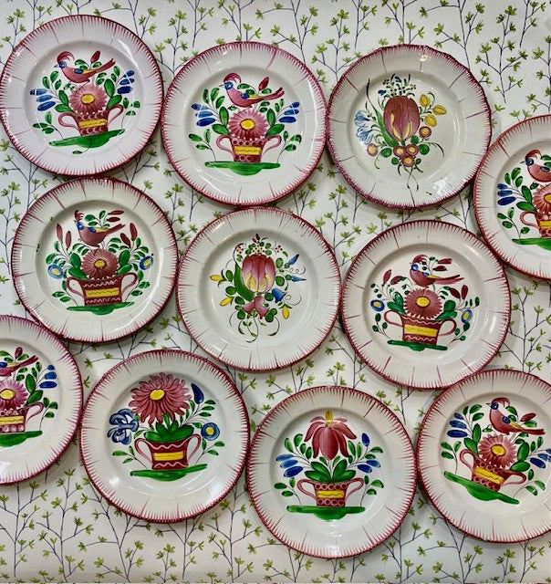 A Collection of Eleven 19th Century French Faience Plates Decorated with Flowers and Birds
