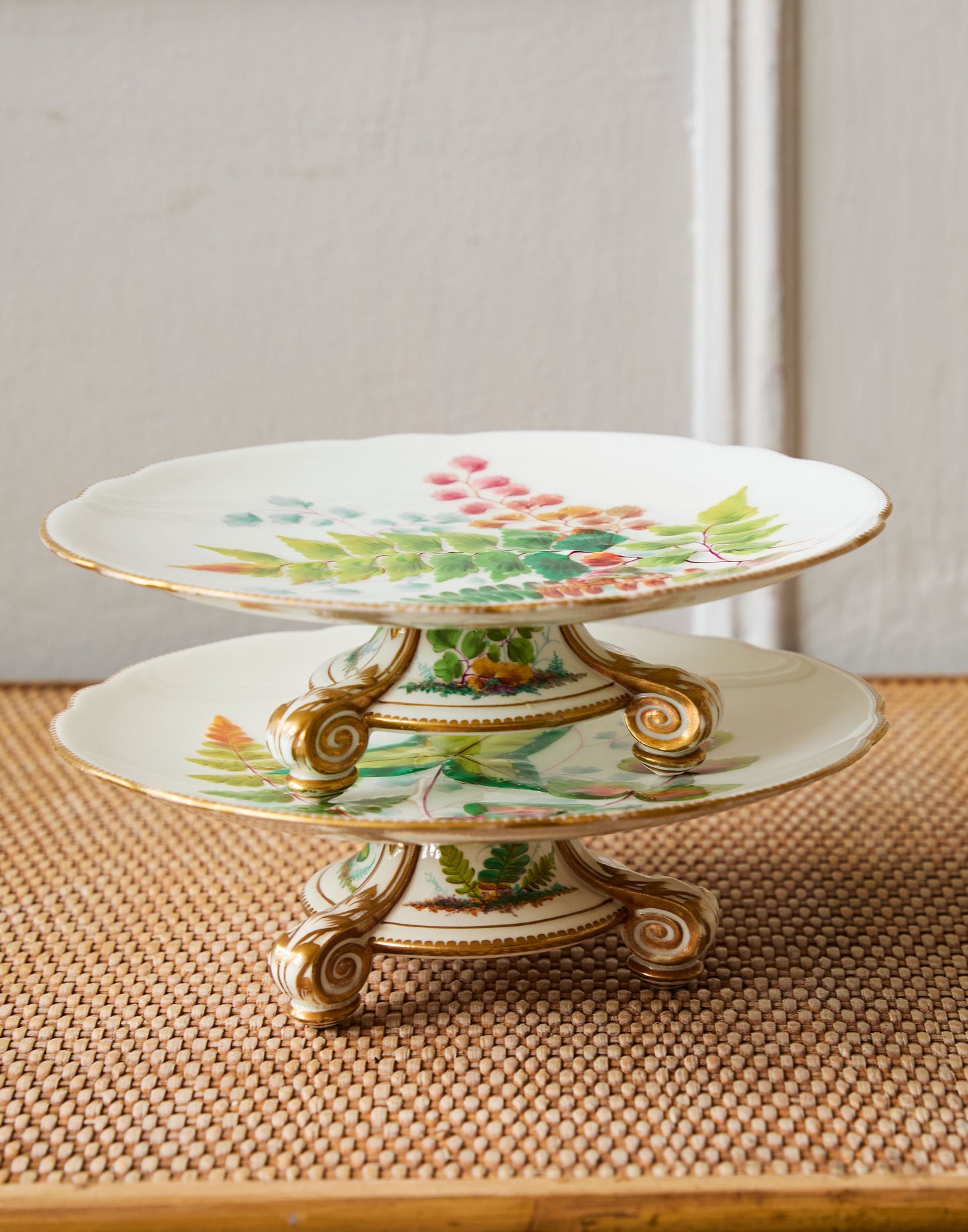 A Pair of 19th Century Porcelain Comports with a Leaf Pattern on a Gold Three-footed Stand