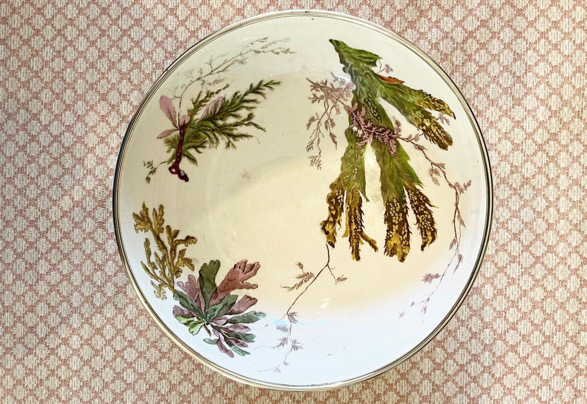 A late 19th Century Wedgwood Queen's Ware Lobster Bowl with a band of silver metal plate and silver plated servers with lobster claw form handles.