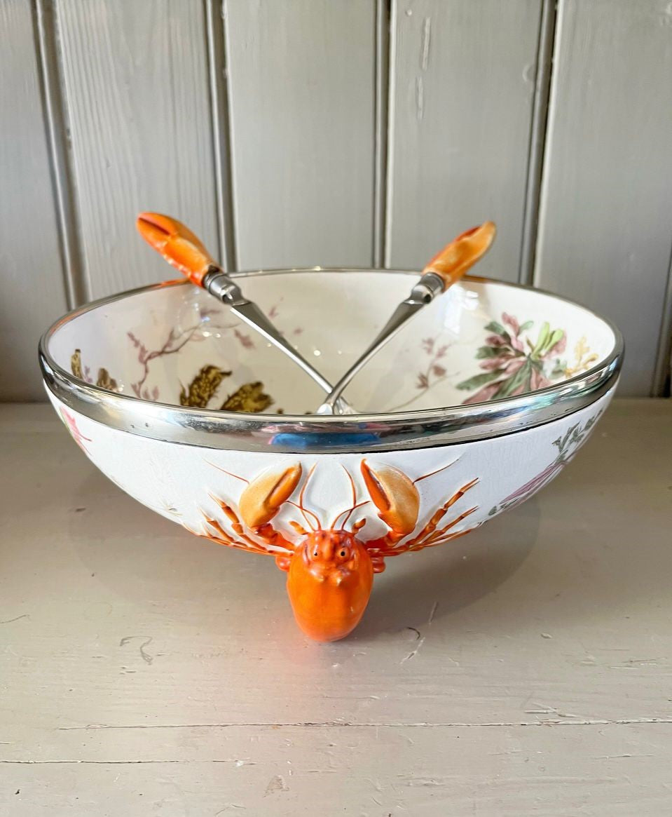 A late 19th Century Wedgwood Queen's Ware Lobster Bowl with a band of silver metal plate and silver plated servers with lobster claw form handles.