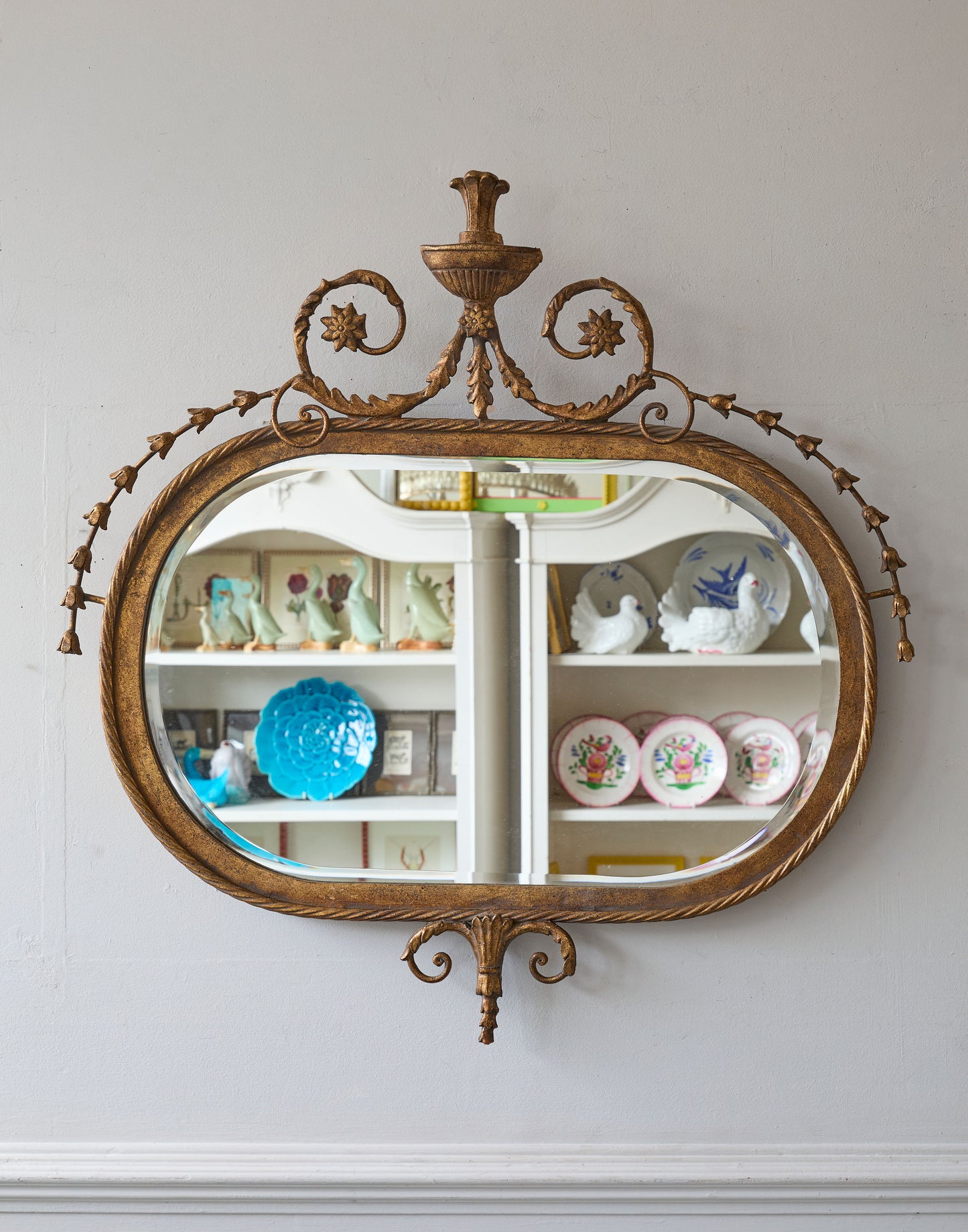 A 20th Century Adam Style Gilt Metal Oval Mirror with Bevelled Plate