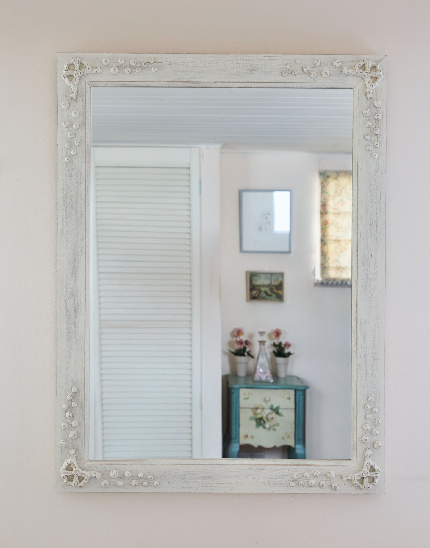 A Mirror with Bow and Bobble Decoration Handpainted in Farrow & Ball White Tie and Distressed Finish