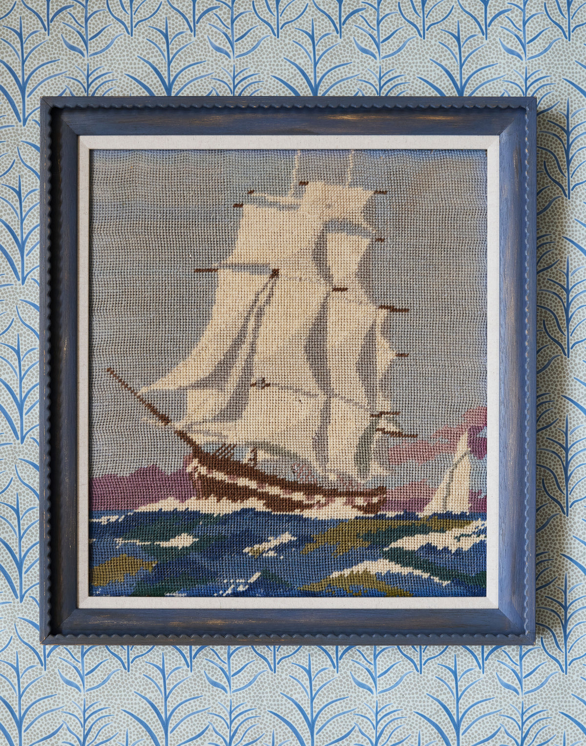 A Vintage Woolwork of a Sailing Ship in Rough Seas