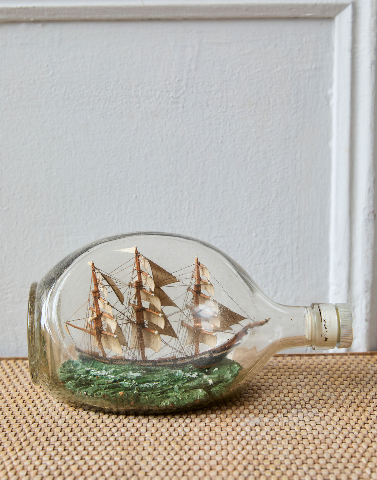 An Early 20th Century Haig Dimple Glass Ship in a Bottle of a Three Masted Barque
