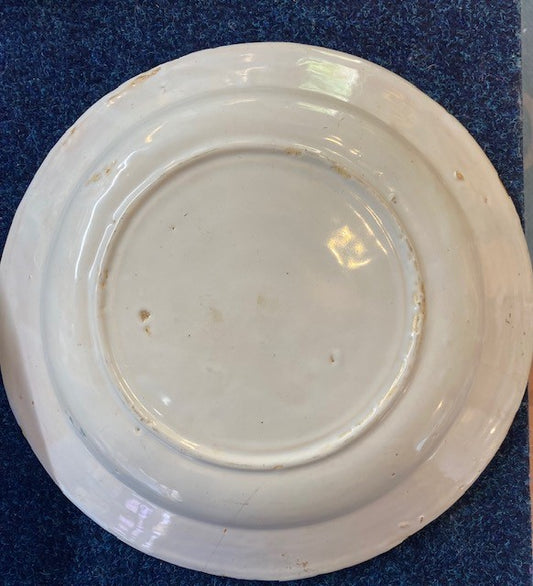 An English 18th century Delftware Earthenware Charger Decorated in Blue with a Bird