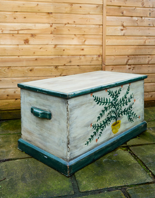 A Hand-Painted Pine Blanket Box with Botanical Motif
