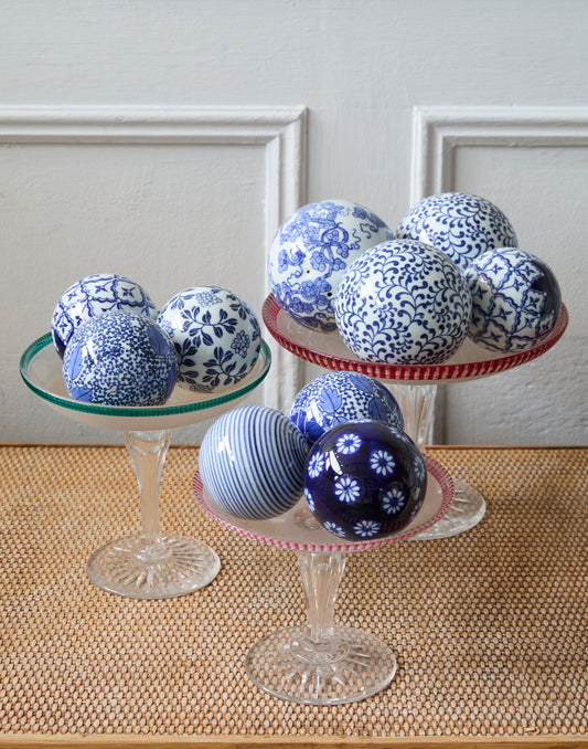 A Collection of Ten Vintage Bombay Company Blue and White Ceramic Carpet Balls