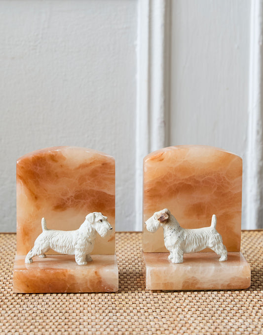 A Pair of Art Deco Onyx Bookends Surmounted by Cold Painted Spelter Models of Scottish Terriers
