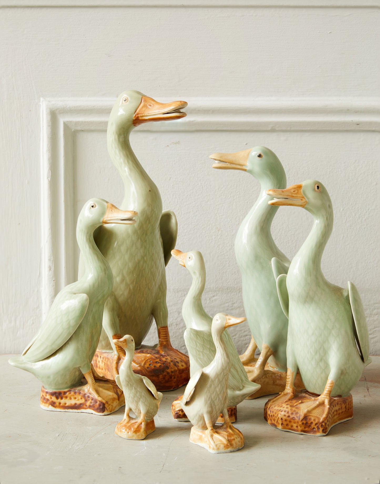 A Graduated Set of Seven Chinese-Export Celadon Glazed Figures of Standing Ducks