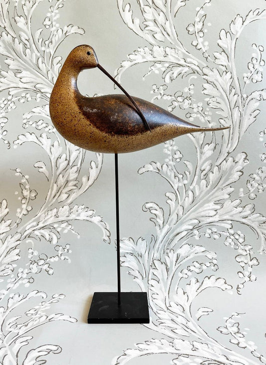 A Wooden Sculpture of a Preening Curlew by Michael Lythgoe (b 1950)