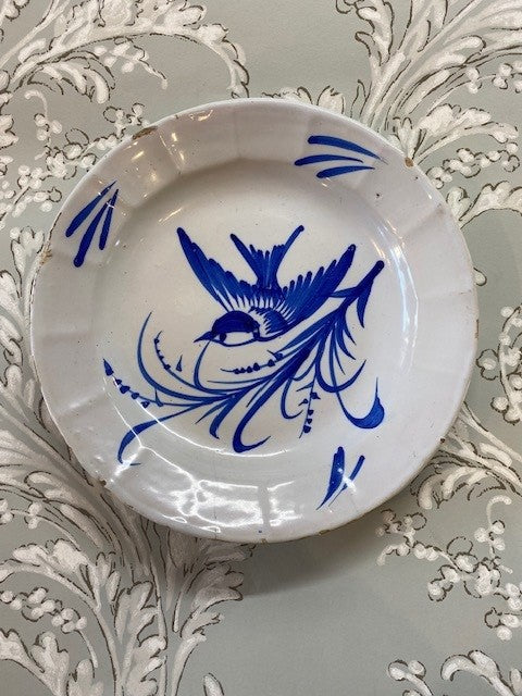 An English 18th century Delftware Earthenware Plate Decorated in Blue with a Bird