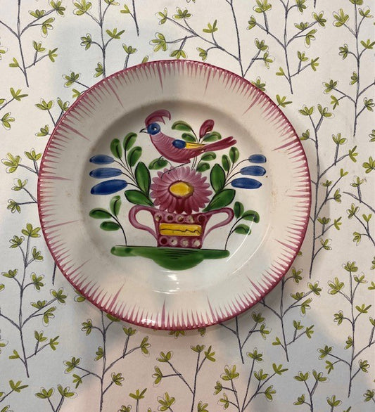 A Collection of Eleven 19th Century French Faience Plates Decorated with Flowers and Birds