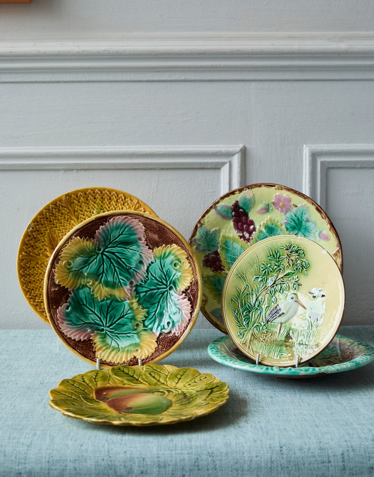 A Collection of Eight French and English Majolica Plates