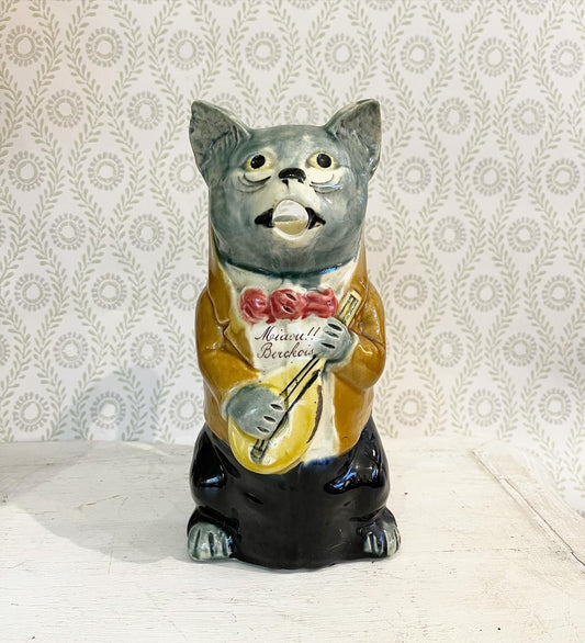 A French Majolica Barbotine Absinthe Jug of a Cat Night-Club Singer with Mandolin
