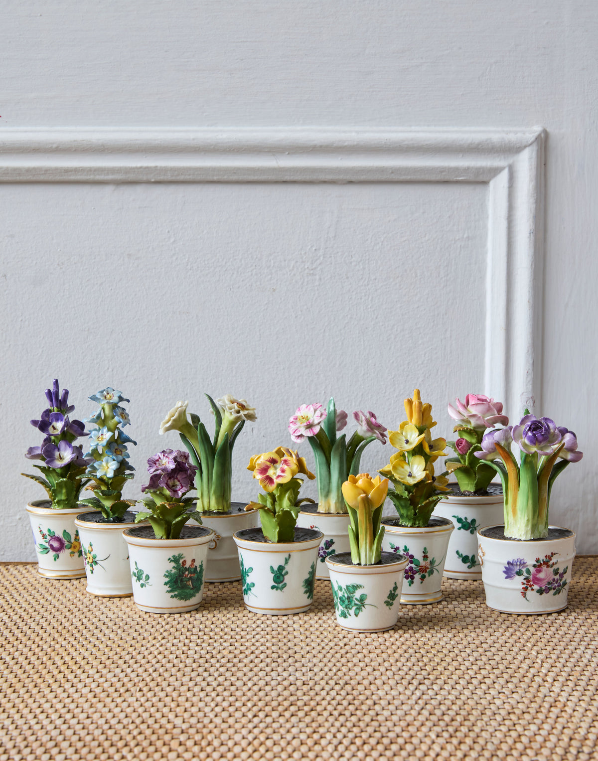 A Set of Ten Miniature Porcelain Flower Arrangements in Hand-Painted Flower Pots