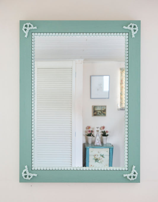 A Mirror with Bow and Bobble Decoration Handpainted in Little Greene Aquamarine Deep