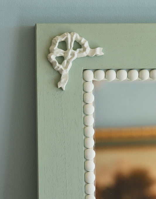 A Mirror with Bow and Bobble Decoration Handpainted in Little Greene Aquamarine Deep