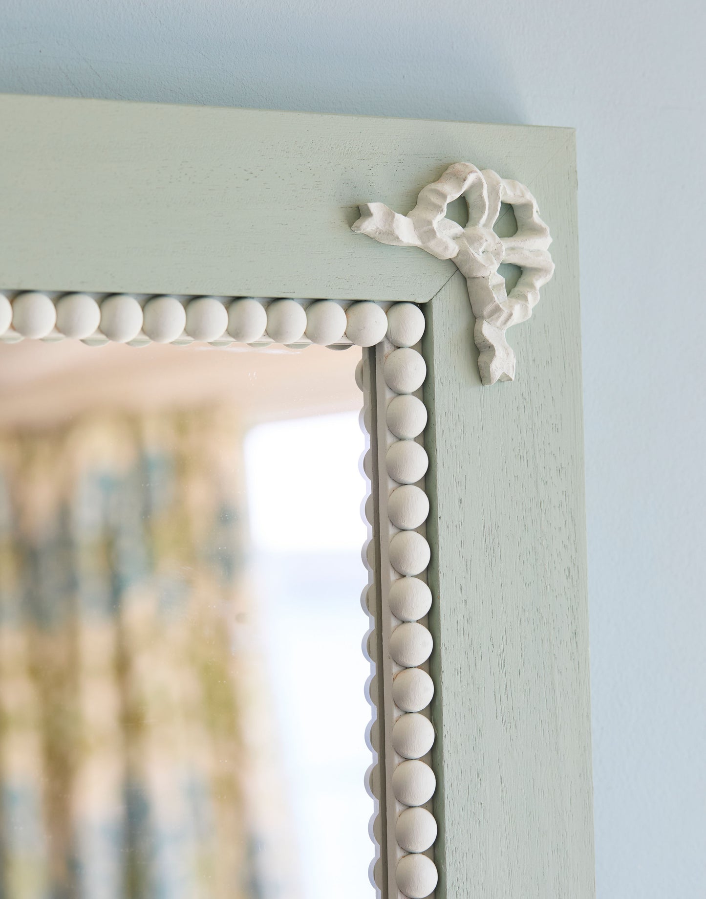 A Mirror with Bow and Bobble Decoration Handpainted in Little Greene Aquamarine Deep