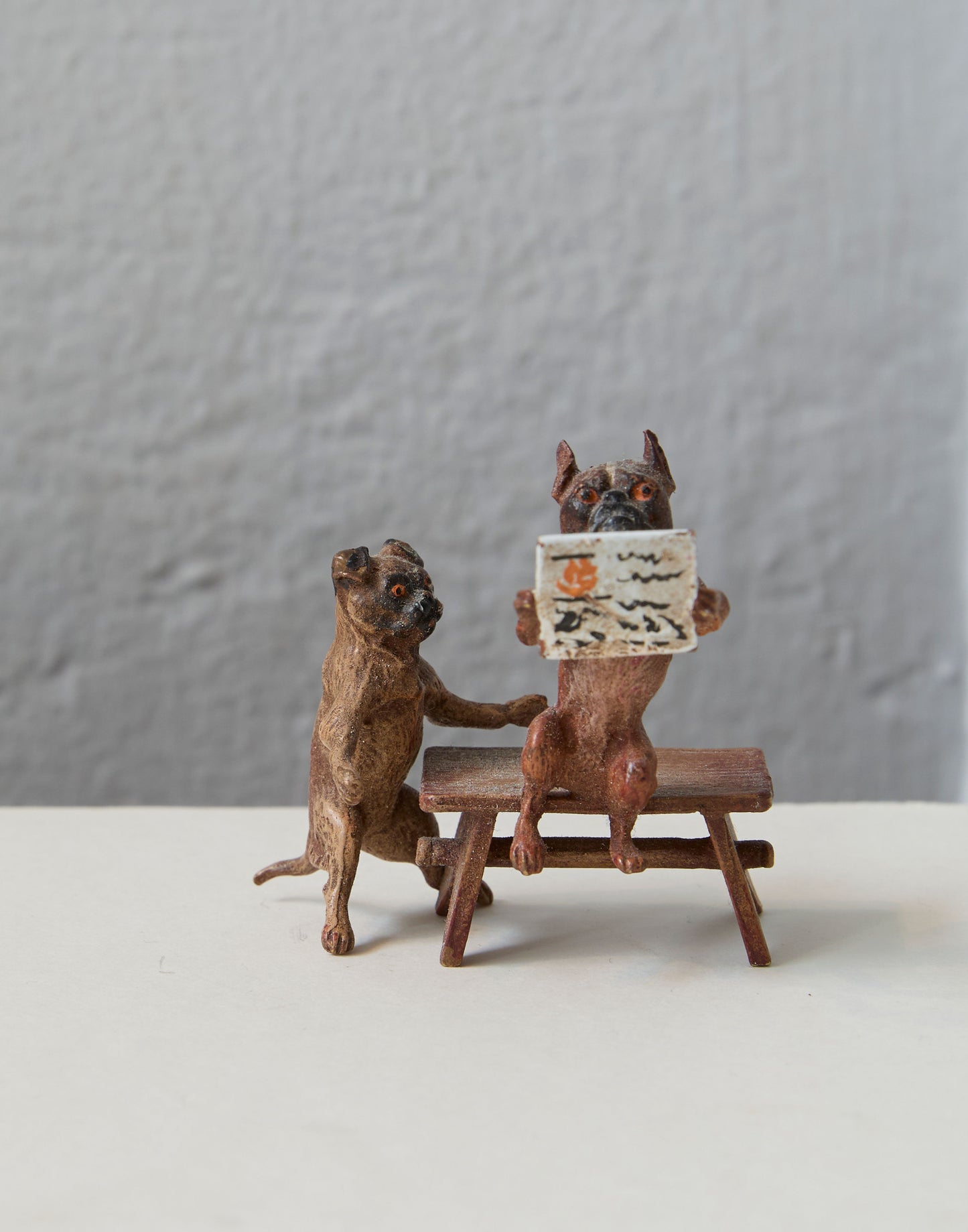 A Set of Three Early 20th Century Cold Painted Models of Pugs; Mouse and Two Wrestling Cats