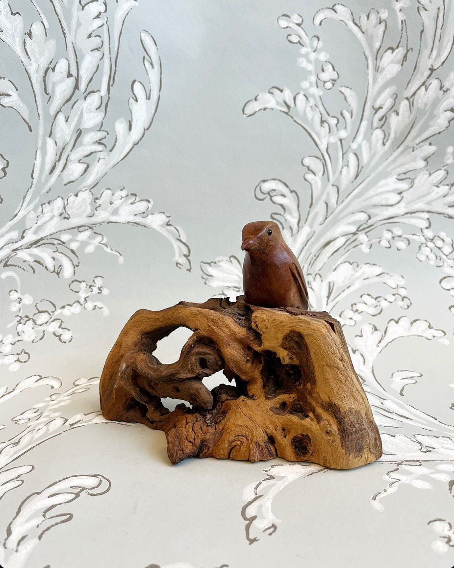 A Vintage Hand-Carved Wren on an Elaborately Carved Fossil Wooden Base