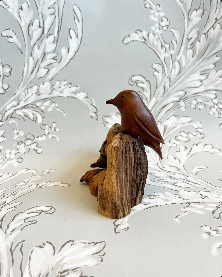 A Vintage Hand-Carved Wren on an Elaborately Carved Fossil Wooden Base