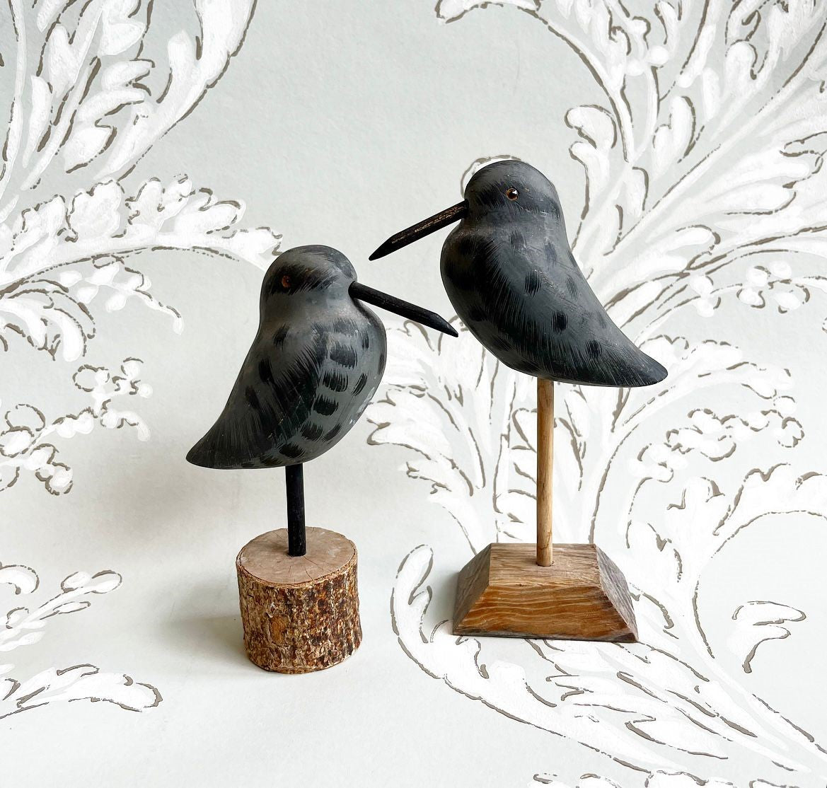 A Pair of Vintage Hand-Painted Grey Shorebird Decoys on Wooden Stands