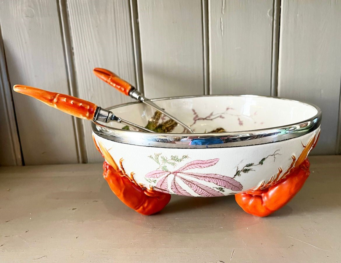 A late 19th Century Wedgwood Queen's Ware Lobster Bowl with a band of silver metal plate and silver plated servers with lobster claw form handles.