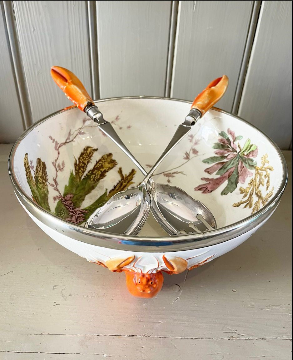 A late 19th Century Wedgwood Queen's Ware Lobster Bowl with a band of silver metal plate and silver plated servers with lobster claw form handles.