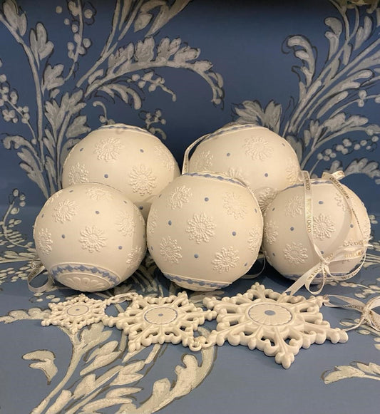 A set of five Wedgwood Jasperware Christmas Snowflake Baubles and a Trio of Cascading Snowflakes