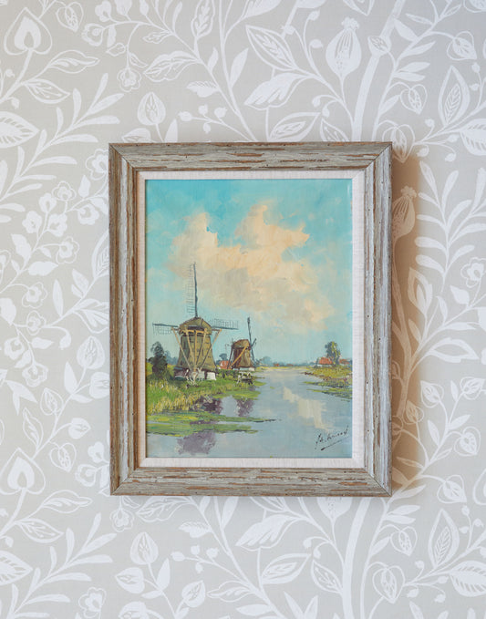 A 20th Century Painting of Windmills in a River Landscape