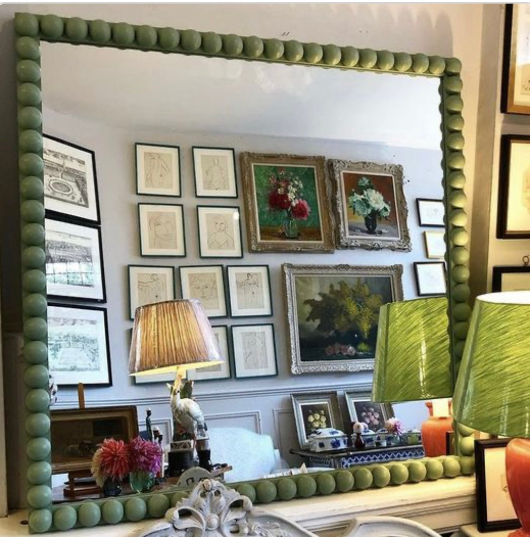 A Large Green Bobble Framed Mirror